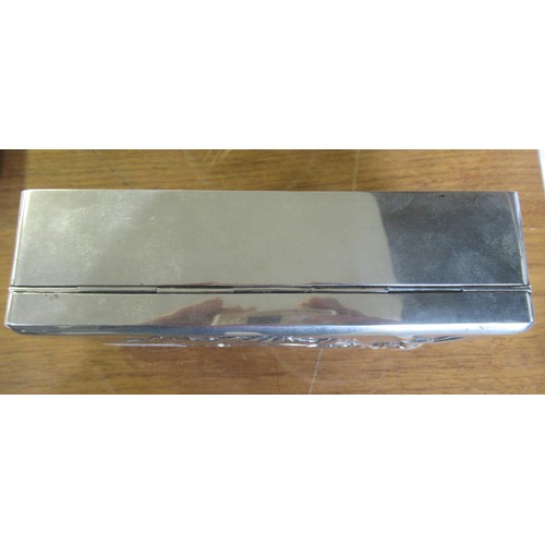 652 - Japanese rectangular silver cigarette box, the cover embossed with bamboo design, 17 x 9 x 5cm high