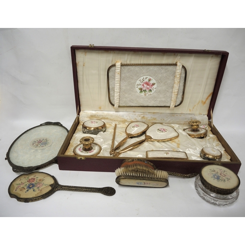 299 - Cased gilt metal dressing table set, together with another similar