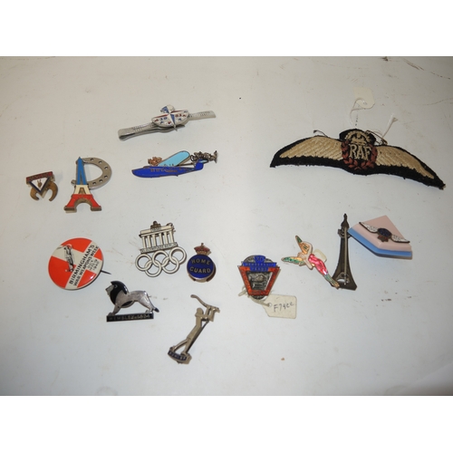325 - 1936 Berlin Olympics brooch, together with various advertising brooches including a Guinness toucan ... 