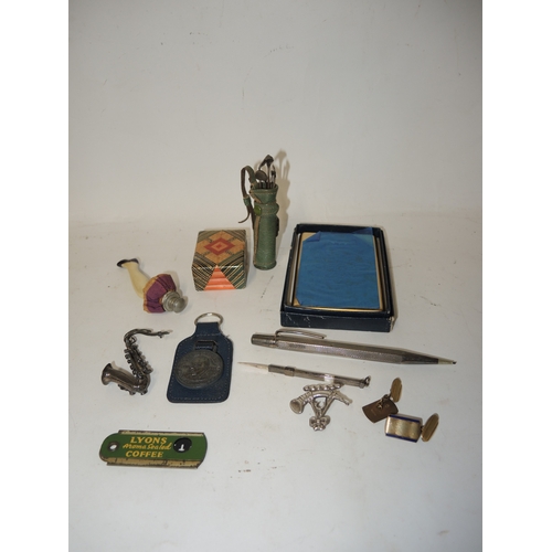 327 - Unusual leather and sterling silver manicure set in the form of a bag of golf clubs, silver brooch i... 