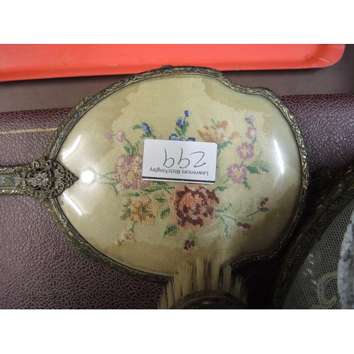 299 - Cased gilt metal dressing table set, together with another similar