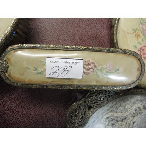 299 - Cased gilt metal dressing table set, together with another similar