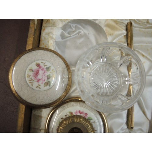 299 - Cased gilt metal dressing table set, together with another similar