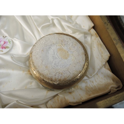 299 - Cased gilt metal dressing table set, together with another similar