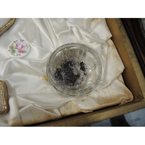 299 - Cased gilt metal dressing table set, together with another similar