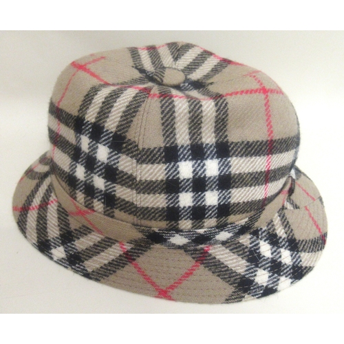 32 - Harrods hat box and another containing a Burberrys hat, size M, two other ladies hats, two fur stole... 