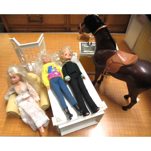 102 - Sindy doll's house together with a quantity of figures, furniture, clothes, accessories etc.