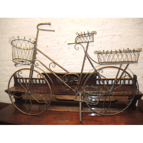 126 - Patinated metal plant stand in the form of a bicycle