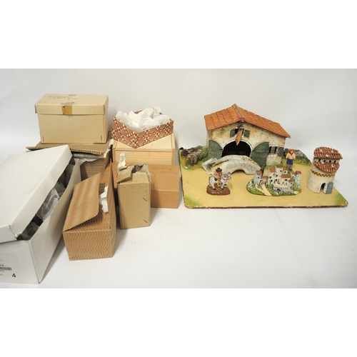 135 - Large quantity of French terracotta figures, farm workers and peasants, together with a wooden farm ... 