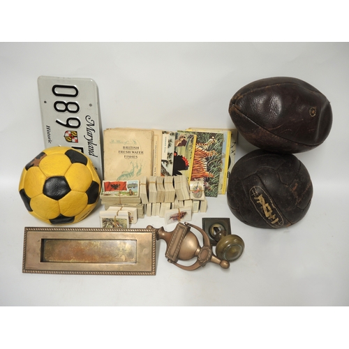 136 - Quantity of cigarette card albums and loose cards, together with a quantity of footballs, a rugby ba... 