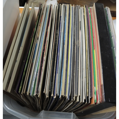 155 - Three boxes containing various LPs and singles including Beatles, ELO, Elvis etc.