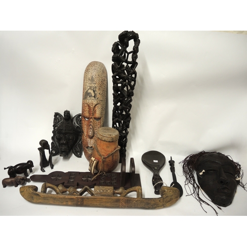 180 - Quantity of African and Far Eastern native carved figures, masks and other items