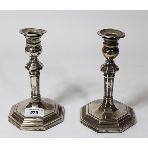 579 - Pair of Sheffield silver octagonal baluster form candlesticks, 18cm high (weighted)