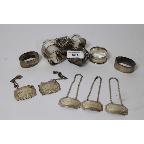 581 - Group of eight silver napkin rings, together with five various silver decanter labels, 6.5oz t