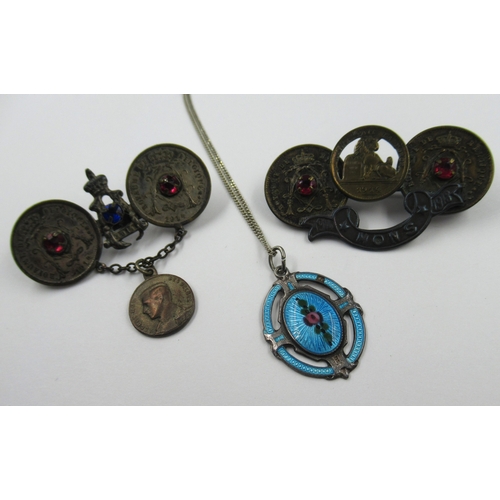 594 - Two World War I Trench Art brooches, together with an enamelled silver pendant on chain