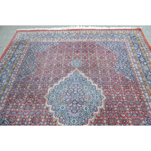6 - Indo Persian rug with a lobed medallion and all-over Herati design on a brick red ground with corner... 
