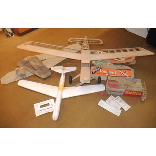 94 - Model balsa wood model aeroplane, together with a part built model aeroplane with various accessorie... 