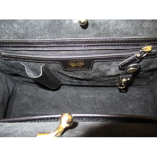 101 - Anya Hindmarch, black leather handbag with gilt metal trim, 32cm wide, with associated dust cover