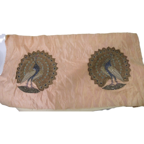 105 - Embroidered peach silk panel of two peacocks in silver and gold thread, unframed