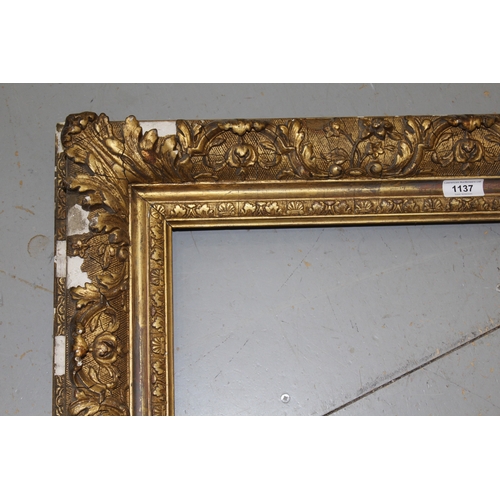 1137 - 19th Century giltwood and composition picture frame having elaborate scroll and leaf decoration, reb... 