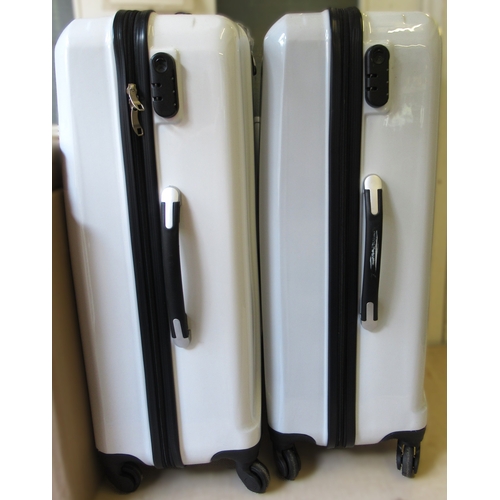 114 - Two unused hard cased spinner suitcases, 78 x 51 x 28cm