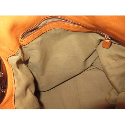 116 - Tod's leather tote bag, together with a pair of Salvatore Ferragamo trousers, size 40