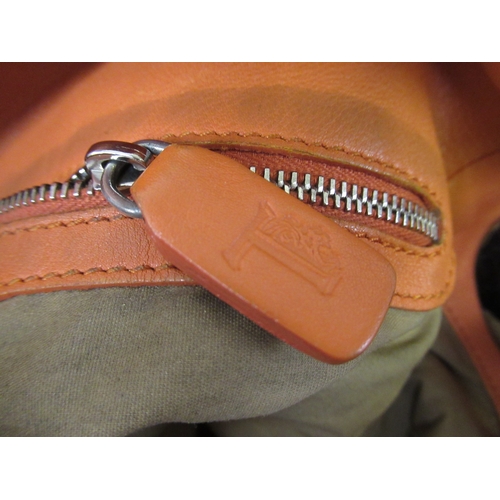 116 - Tod's leather tote bag, together with a pair of Salvatore Ferragamo trousers, size 40