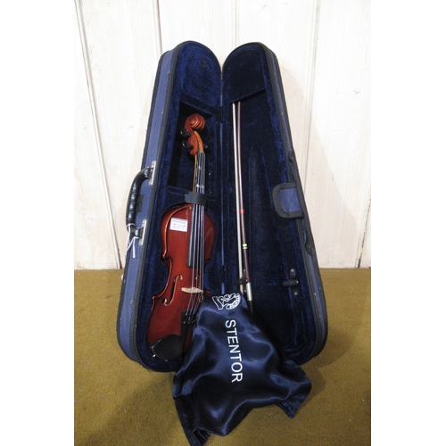 207 - Student quarter size violin in a fitted case, together with a 1/32nd scale violin by Stentor in fitt... 