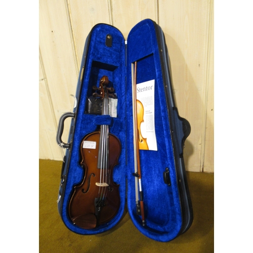 208 - Two quarter size student violins by Stentor, in fitted cases