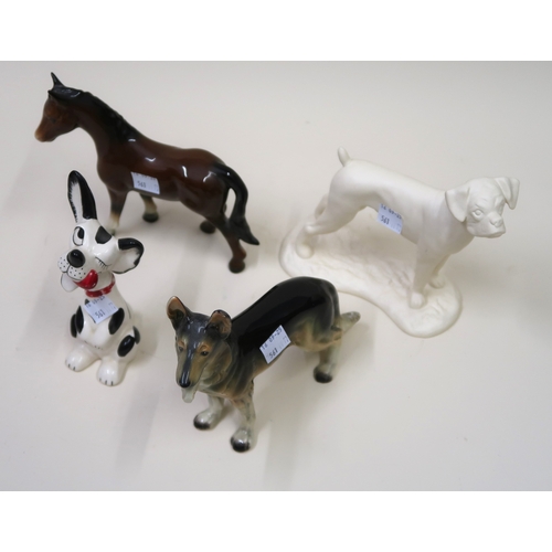 561 - Collection of porcelain and pottery figures of dogs by Royal Doulton, Beswick and others