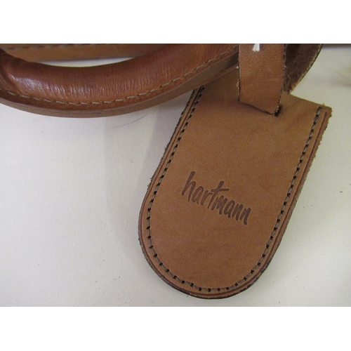 73 - 20th Century tan leather Hartmann briefcase with original labels and tags