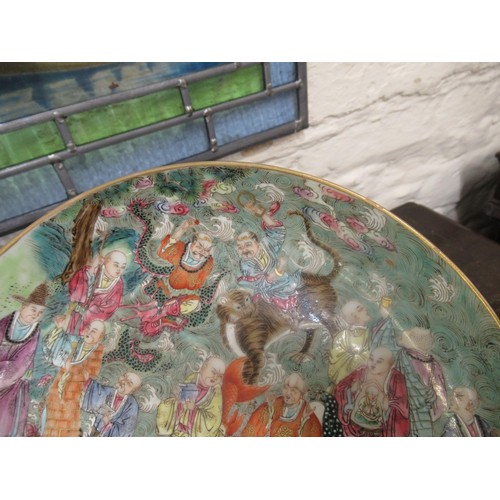 585 - Chinese circular shallow bowl painted with figures and animals, 22cm diameter, with seal mark to bas... 