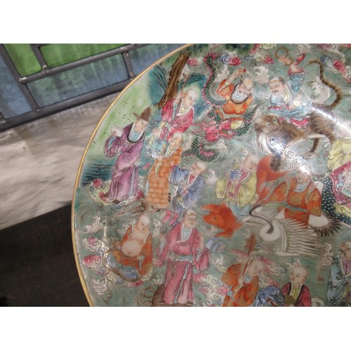 585 - Chinese circular shallow bowl painted with figures and animals, 22cm diameter, with seal mark to bas... 