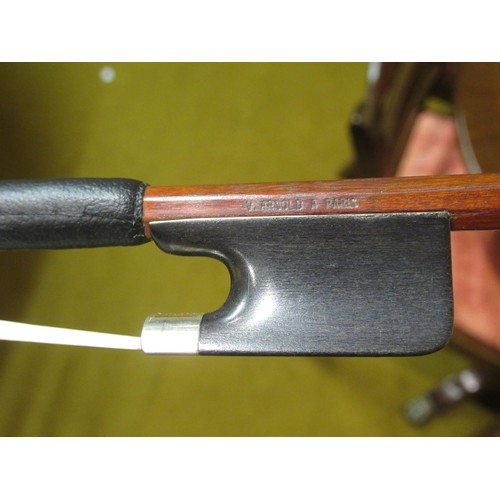 198 - Case containing a collection of six various violin bows including one signed Arnold, Paris