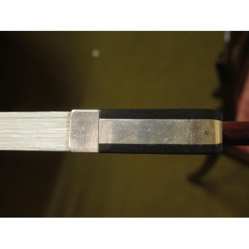 198 - Case containing a collection of six various violin bows including one signed Arnold, Paris