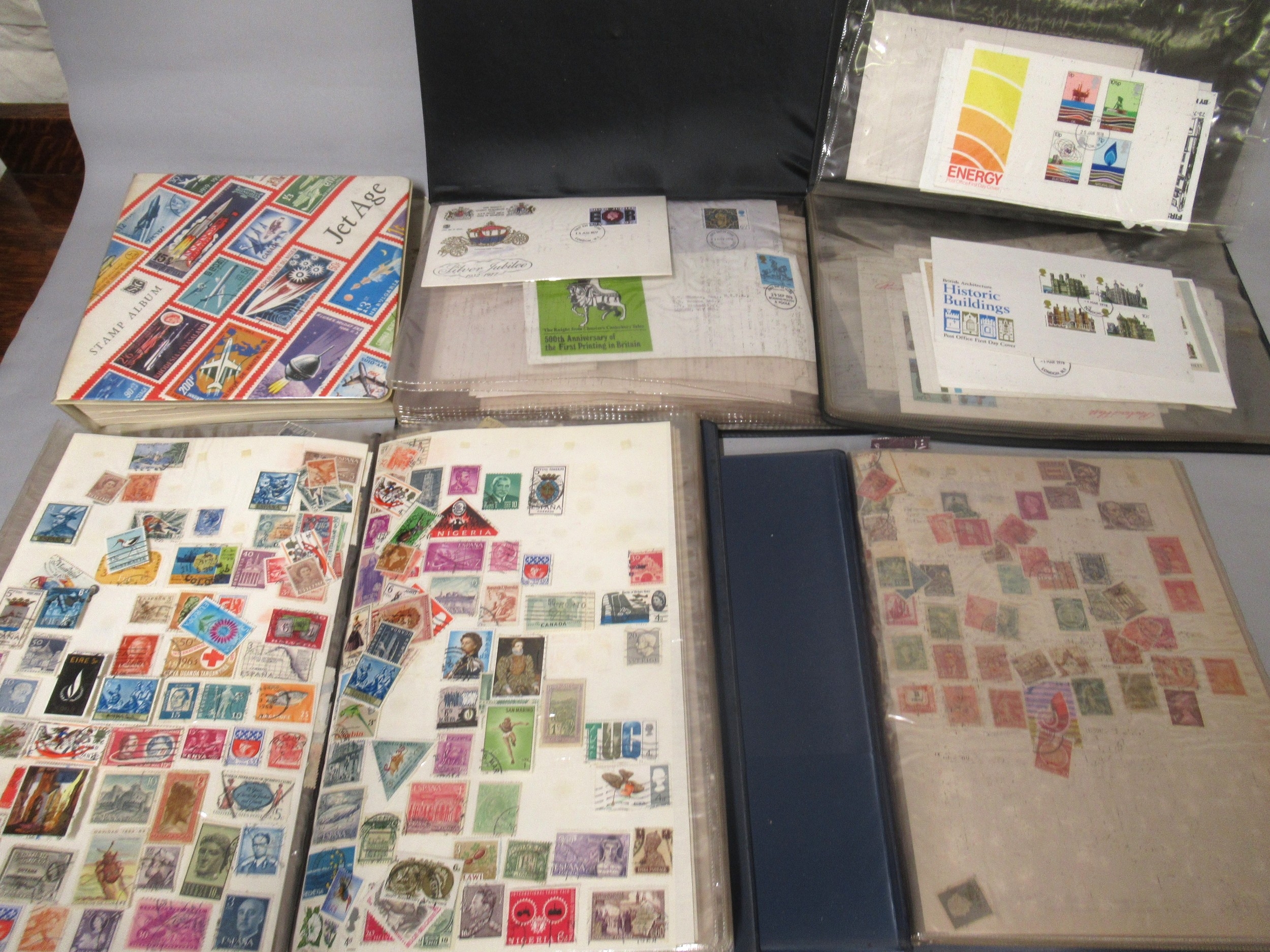 Five albums containing a quantity of various World stamps