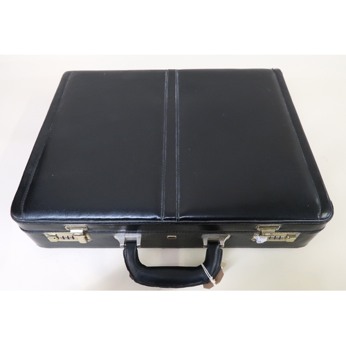 37 - Black leather briefcase by Equinox (interior at fault)