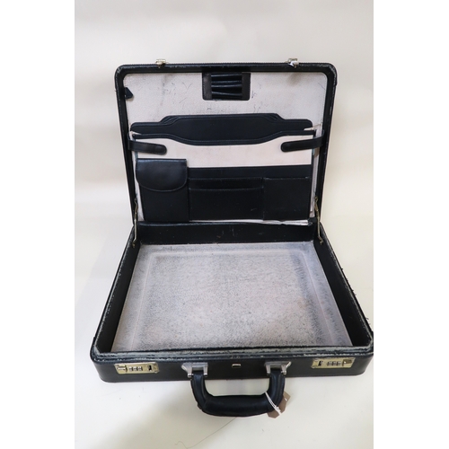 37 - Black leather briefcase by Equinox (interior at fault)