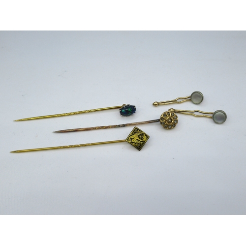 775 - Gold black opal set stick pin, another stick pin set rose cut diamonds and seed pearl, gilt metal st... 
