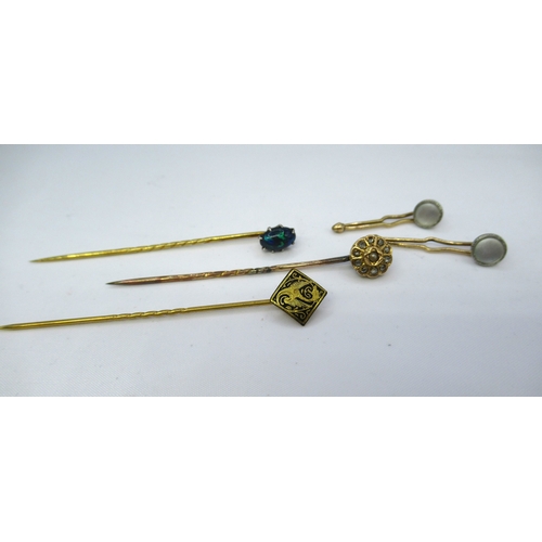 775 - Gold black opal set stick pin, another stick pin set rose cut diamonds and seed pearl, gilt metal st... 