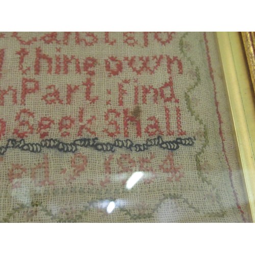 29 - Victorian needlework sampler of alphabet and motto design, signed Mary Cittins? aged 9, 1854, 35 x 2... 