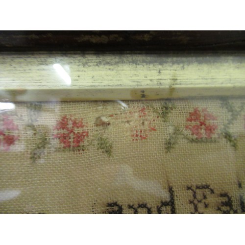 33 - Early Victorian needlepoint sampler worked with a memorial poem, stylised flowers and buildings, sig... 
