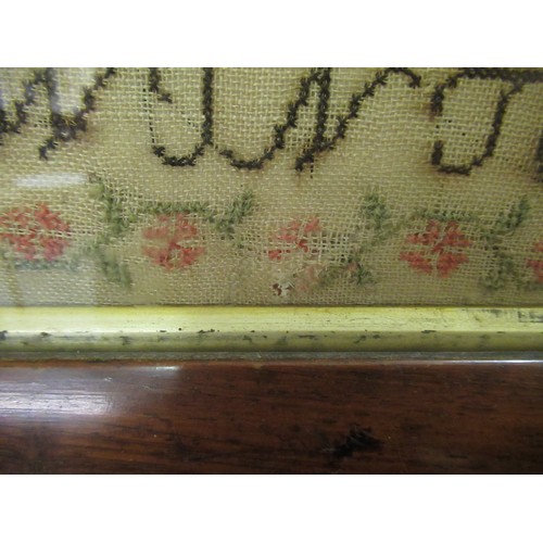 33 - Early Victorian needlepoint sampler worked with a memorial poem, stylised flowers and buildings, sig... 