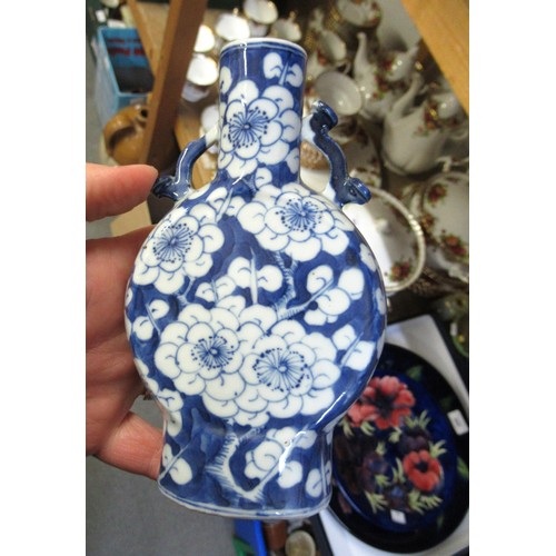 477 - Pair of small 19th Century Chinese blue and white prunus blossom moon flasks, each with a four chara... 