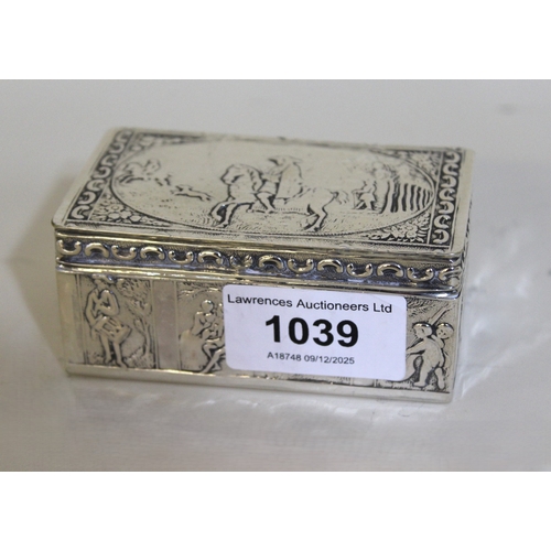 1039 - 19th Century Dutch silver rectangular snuff box with hinged cover and embossed figural decoration, 8... 