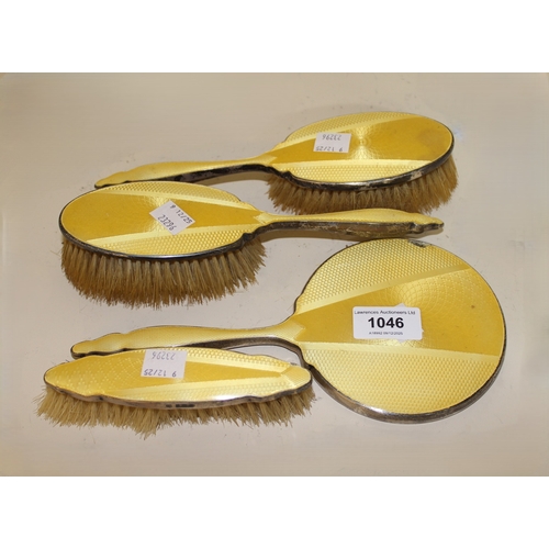 1046 - Birmingham silver and yellow translucent enamel decorated four piece dressing table set
