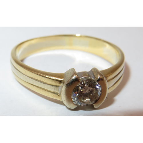 1157 - 18ct Yellow gold solitaire diamond ring with a ribbed shank, the stone of approximately 5mm diameter... 