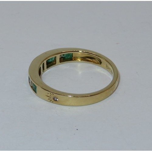 1159 - 14ct Yellow gold nine stone emerald and diamond half eternity ring, size 'N', 2.7g