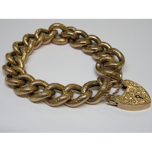 1250A - 9ct Gold curb link bracelet with engraved links and padlock clasp, 27g