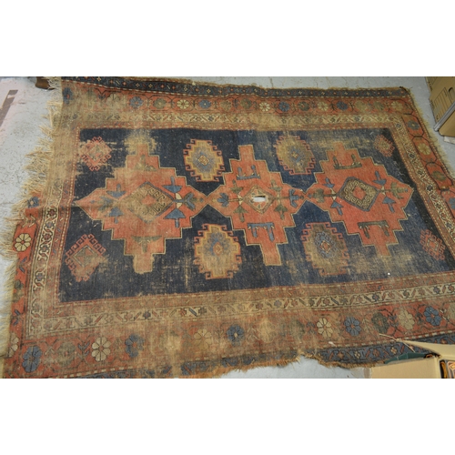 142 - Kazak rug having medallion design with red and blue ground having multiple borders (at fault)